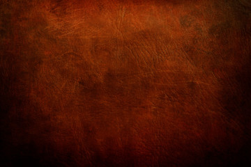 old red leather, grunge background with dark vignette borders