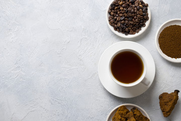 Chaga drink with coffee in cup. Trendy Russian healthy infusion. Top view.