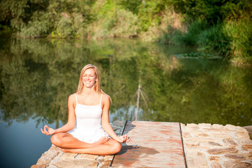 Young woman exercising yoga 