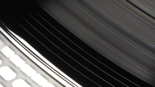 Black vinyl record playing macro close up