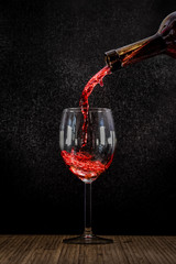 Pouring wine into glas