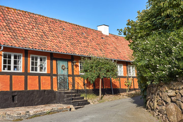 Fototapeta na wymiar Traditional half-timbered house in the town of Gudhjem, Bornholm island, Denmark.
