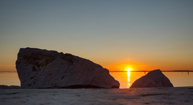 Photo of a sunset between two rocks in Duino - Friuli Venezia Giulia - Italy Ver. 1
