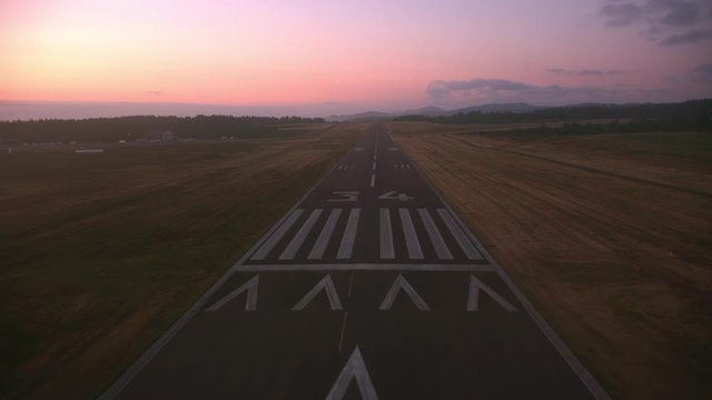 Landing on runway at dusk.  Shot from helicopter with cineflex gimal and RED 8K camera.