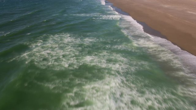 Aerial view of waves along coastline