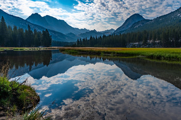 Dramatic Sky over McClure Meadows and reflection in the calm river along the PCT - Pacific Crest...