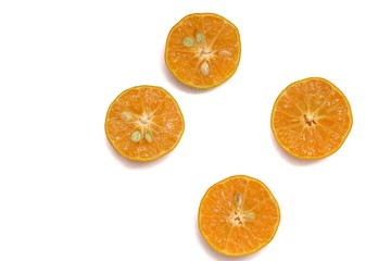 Fototapeta premium A group of half cut oranges fruit on white isolated background