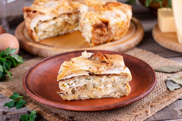 Homemade pie with cheese and herbs