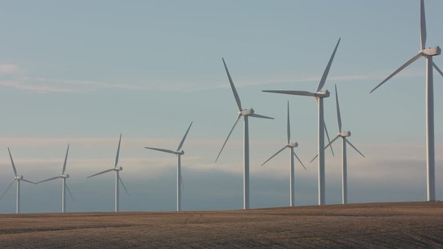 Tracking shot of energy producing wind turbines in Oregon. 