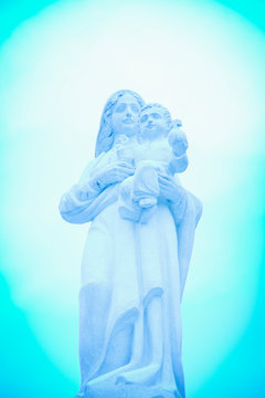 Ancient statue. Virgin Mary with Jesus Christ. Religion, faith, Christianity concept.