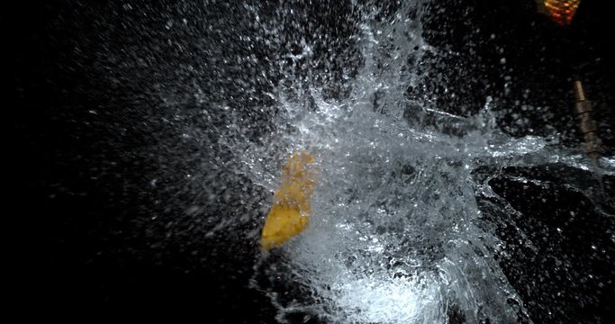 Dart popping a water balloon in super slow motion.  Shot on Phantom VEO 4K.  