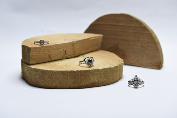Wedding rings on wooden chops
