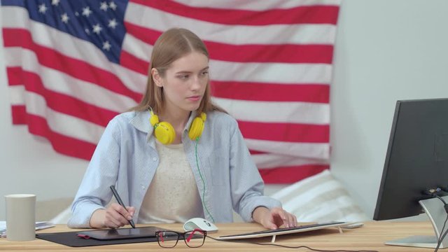 Graphic Designer Working On Computer Drawing A New Project And Recieving Or Answering Phone Call