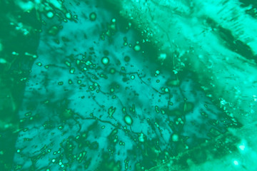 Blurred abstract background of aqua menthe color and blue.