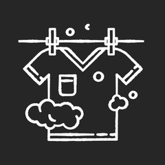 Outdoor drying chalk white icon on black background. Laundry, clothesline, outside clothes drying. T-shirt hanging on rope, clean summer clothing. Isolated vector chalkboard illustration