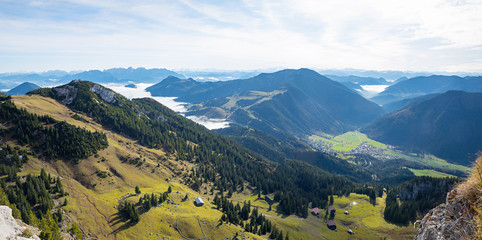 Fototapeta premium panorama view from Wendelstein mountain, green pasture in the bavarian alps and valley