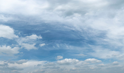 A blue sky with beautiful large fluffy clouds