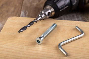Tools and screws used in carpentry. Small carpentry work in the workshop.