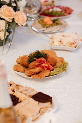 Wedding. Banquet. The table for guests. Appetizers and salads on the banquet table. Cold appetizers and salads on the wedding table.