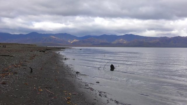 Cloudy morning on the Kamchatka Peninsula. River and clouds over the mountains