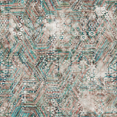Seamless mixed media collage design in old aged worn look. Variable kaleidoscope design overlaid, mottled, and distressed on fabric texture. Seamless repeat raster jpg pattern swatch.