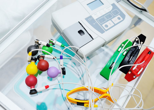 multi-colored vacuum sensors for recording ECG or ECG-cardiogram close-up. Equipment for diagnostics of a condition of the heart,electrocardiogram. The concept of health