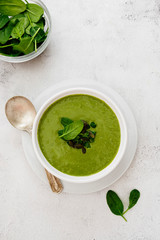 Creamy vegetable soup on bright table. Healthy detox food. Vegetarian food.