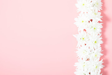 Fototapeta na wymiar Beautiful flowers composition. White flowers on pastel pink background. Valentines Day, Easter, Birthday, Happy Women's Day, Mother's day. Flat lay, top view, copy space