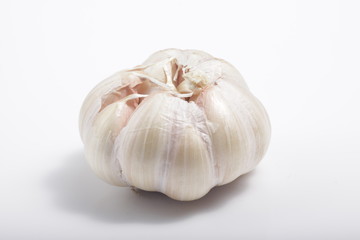 Close - up shot of garlic on a white isolated background