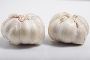 Close - up shot of garlic on a white isolated background
