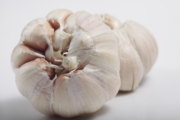 Close - up shot of garlic on a white isolated background