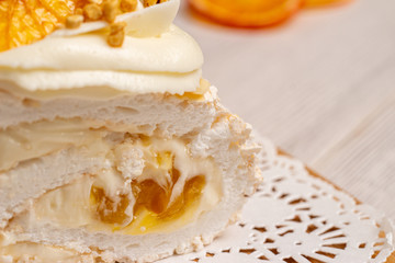 Juicy sliced meringue cake with dried fruits