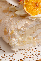 Juicy sliced meringue cake with dried fruits