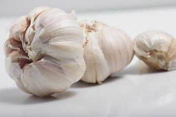 Close - up shot of garlic on a white isolated background