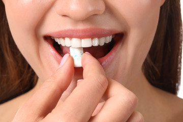 Fototapeta premium Young woman with chewing gum, closeup