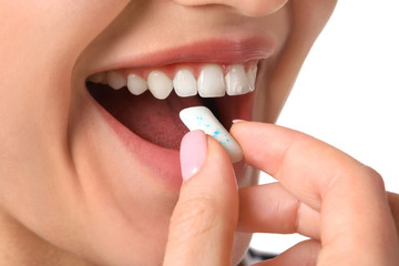 Young woman with chewing gum, closeup