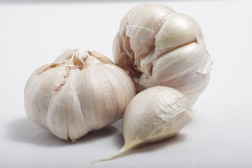 Close - up shot of garlic on a white isolated background