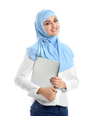 Young Arab woman with laptop on white background