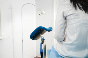 Woman at gynecologist office sitting and waiting for a doctor with test results