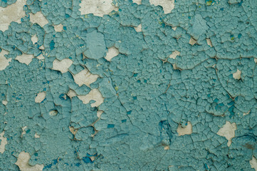 Old painted wall with cracked paint