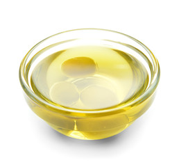 Bowl of tasty olive oil on white background