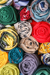 Different beautiful scarves as background