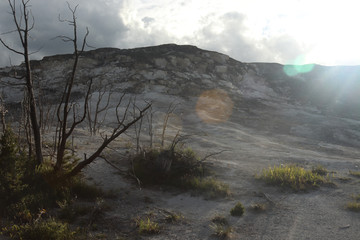 sun shining down on the mountainside