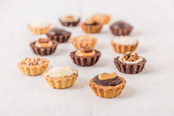 Tasty cupcakes on a white wooden table 
