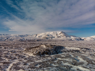 Winter landcape with snow covered mounatins in Iceland