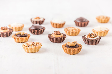 Tasty cupcakes on a white wooden table 