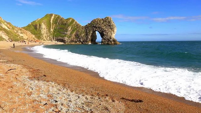 Durdle door and the big waves, filmed from the beach, Dorset, England