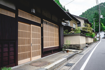 Closed wood doors in Kurama, Japan