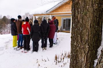A community of conservationists standing around and discussing something. The environmentalists...