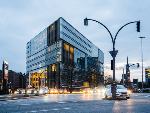 Hamburg, Germany - Mar 21, 2018: Headquarter of Zweites Deutsches Fernsehen Anstalt des offentlichen Rechts ZDF television building with cars driving at dusk